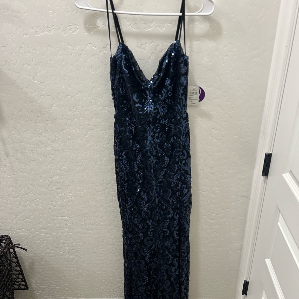 New with tags prom dress size small. Beautiful black with blue sequin dress.